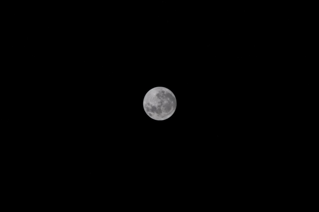 A full Moon on the night of Aug. 1— the first of two in the month— as the International Space Station orbited 265 miles above Earth.