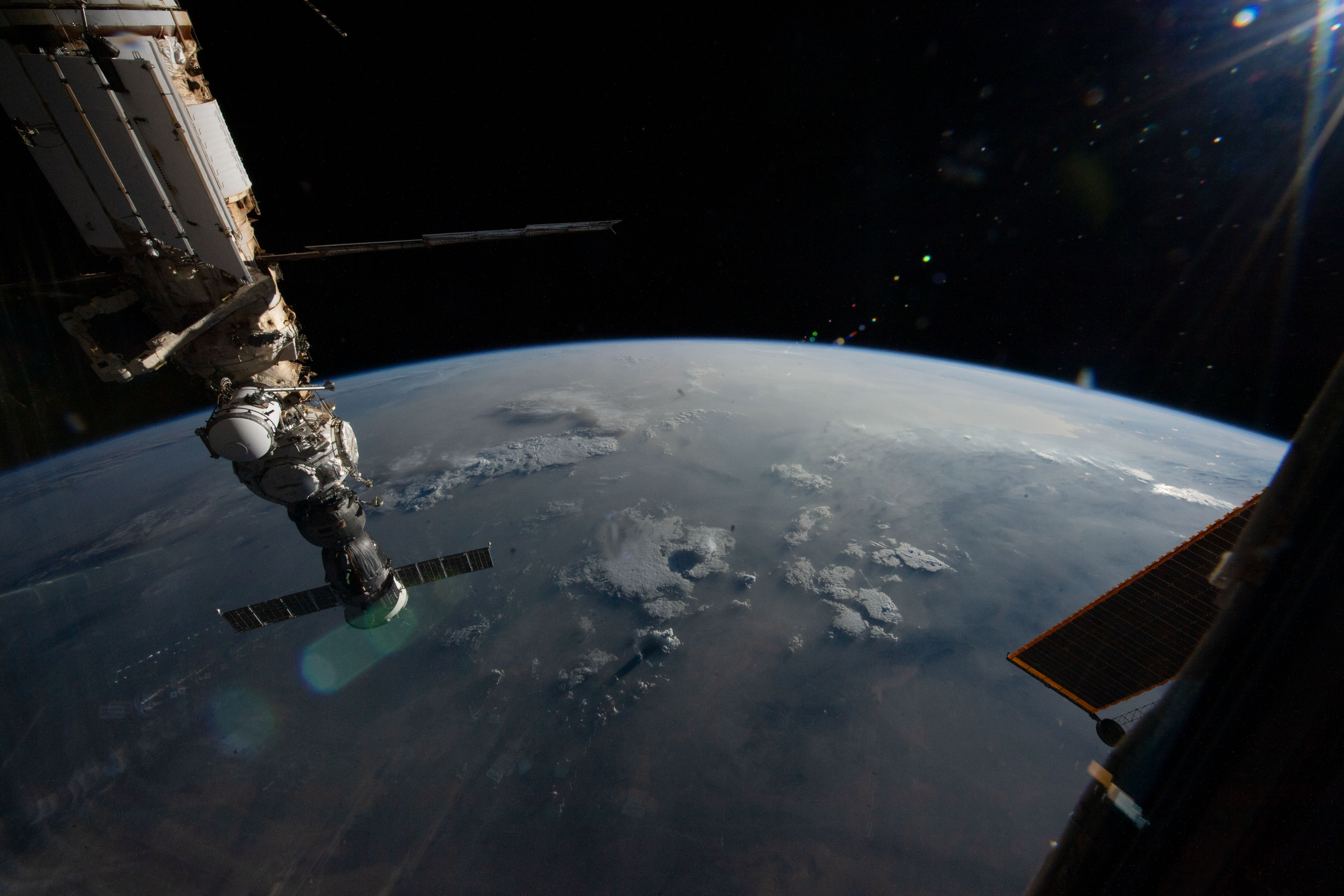 iss069e031703 (July 16, 2023) --- At left, the Soyuz MS-23 crew ship is docked to the Prichal docking module which is itself attached to the Nauka science module. The International Space Station was orbiting 260 miles above southern Iran at the time of this photograph.