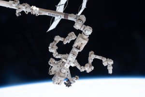 The Special Purpose Dexterous Manipulator (SPDM), also known as Dextre, is pictured attached to the International Space Station's Canadarm2 robotic arm. The SPDM is the orbiting lab's fine-tuned robotic hand designed for precise handling abilities and routine maintenance tasks such as replacing batteries and cameras in the harsh environment of space.