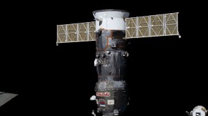 The ISS Progress 84 cargo craft is pictured docked to the Poisk module on the International Space Station.