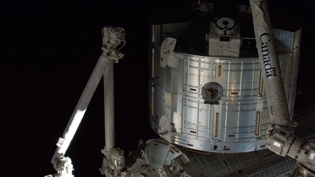 The Kibo laboratory module is comprised of several components including the Pressurized Module where station crew members conduct science experiments, the Logistics module (pictured here) where science gear and research samples are stored, and the Exposed Facility where external experiments can deployed to understand the harsh effects of the space environment. Also pictured are portions of two robotic arms including Japan's robotic manipulator system (left) that can maneuver external experiments and deploy nanosateliites, and the Canadarm2 robotic arm that can capture, install, and release cargo craft, as well as maneuver spacewalkers and International Space Station hardware.