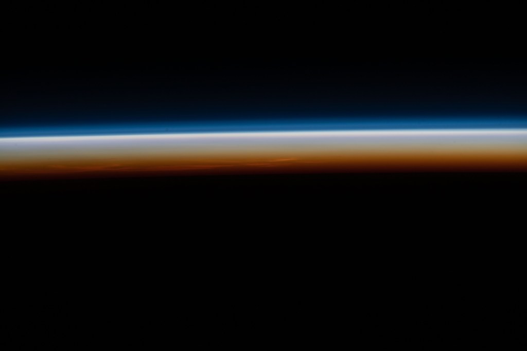The last rays of an orbital sunset illuminate Earth's horizon in this photograph from the International Space Station as it orbited 265 miles above southern Namibia on the African continent.