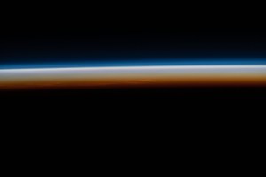 The last rays of an orbital sunset illuminate Earth's horizon in this photograph from the International Space Station as it orbited 265 miles above southern Namibia on the African continent.