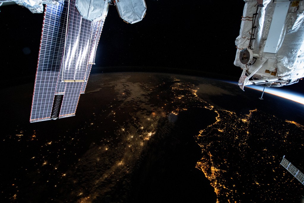 This nighttime photograph shows the Mediterranean Sea ringed by the coastal city lights of Morocco and Algeria on the African side and Spain on the European side. The city lights extending to the Strait of Gibraltar and the Atlantic Ocean are also prominent. The International Space Station was orbiting 261 miles above the Balearic Sea off the coast of Mallorca at the time of this photograph.
