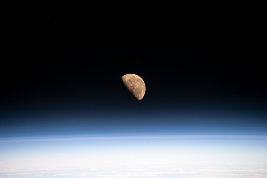 The Moon, pictured the day before going into its Last Quarter phase, is seen from the International Space Station as it orbited 266 miles above the Pacific Ocean northeast of New Zealand.