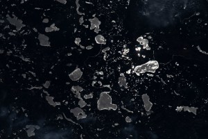 The Moon's glint beams off lakes on the U.S.-Canadian border, between the state of Minnesota and the province of Ontario, in this nighttime photograph from the International Space Station as it orbited 260 miles above North America.