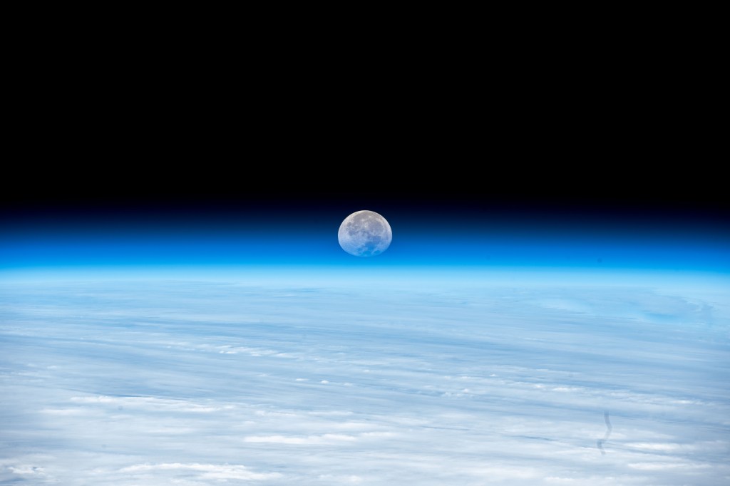 The Moon's image is refracted due to Earth's atmosphere in this photograph from the International Space Station as it orbited 262 miles above the Pacific Ocean south of Alaska's Aleutian islands.