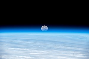 The Moon's image is refracted due to Earth's atmosphere in this photograph from the International Space Station as it orbited 262 miles above the Pacific Ocean south of Alaska's Aleutian islands.