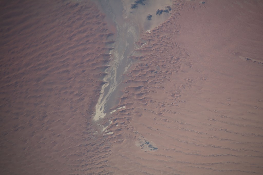 This portion of the Namib Desert in southern Namibia boasts some of the tallest dunes in the world attracting the attention of geologists for further study. The International Space Station was orbiting 266 miles above the Atlantic Ocean at the time this photograph was taken.