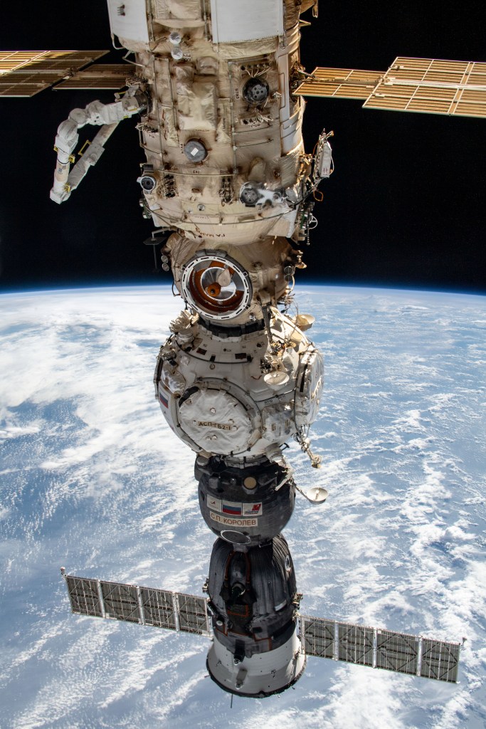 From top to bottom, the Nauka multipurpose laboratory module, the Prichal docking module, and the Soyuz MS-21 crew ship are pictured attached to the Russian segment of the International Space Station. Visible at upper left, is the new European robotic arm attached to Nauka.