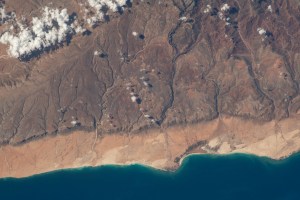 The southern coast of Yemeni's island of Socotra in the Arabian Sea was pictured by NASA astronaut and Expedition 69 Flight Engineer Woody Hoburg as the International Space Station orbited 257 miles above.