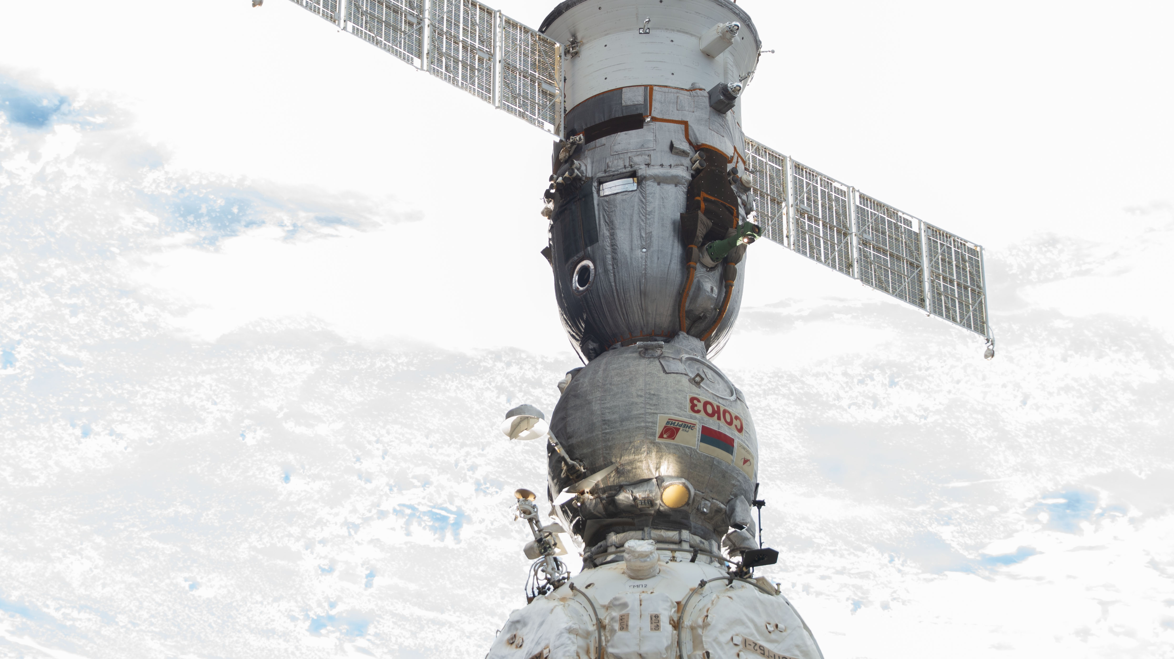 The Soyuz MS-23 crew ship is pictured docked to the Prichal docking module as the International Space Station orbited 262 miles above a cloudy Nigeria on the African continent.