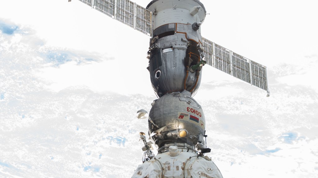 The Soyuz MS-23 crew ship is pictured docked to the Prichal docking module as the International Space Station orbited 262 miles above a cloudy Nigeria on the African continent.