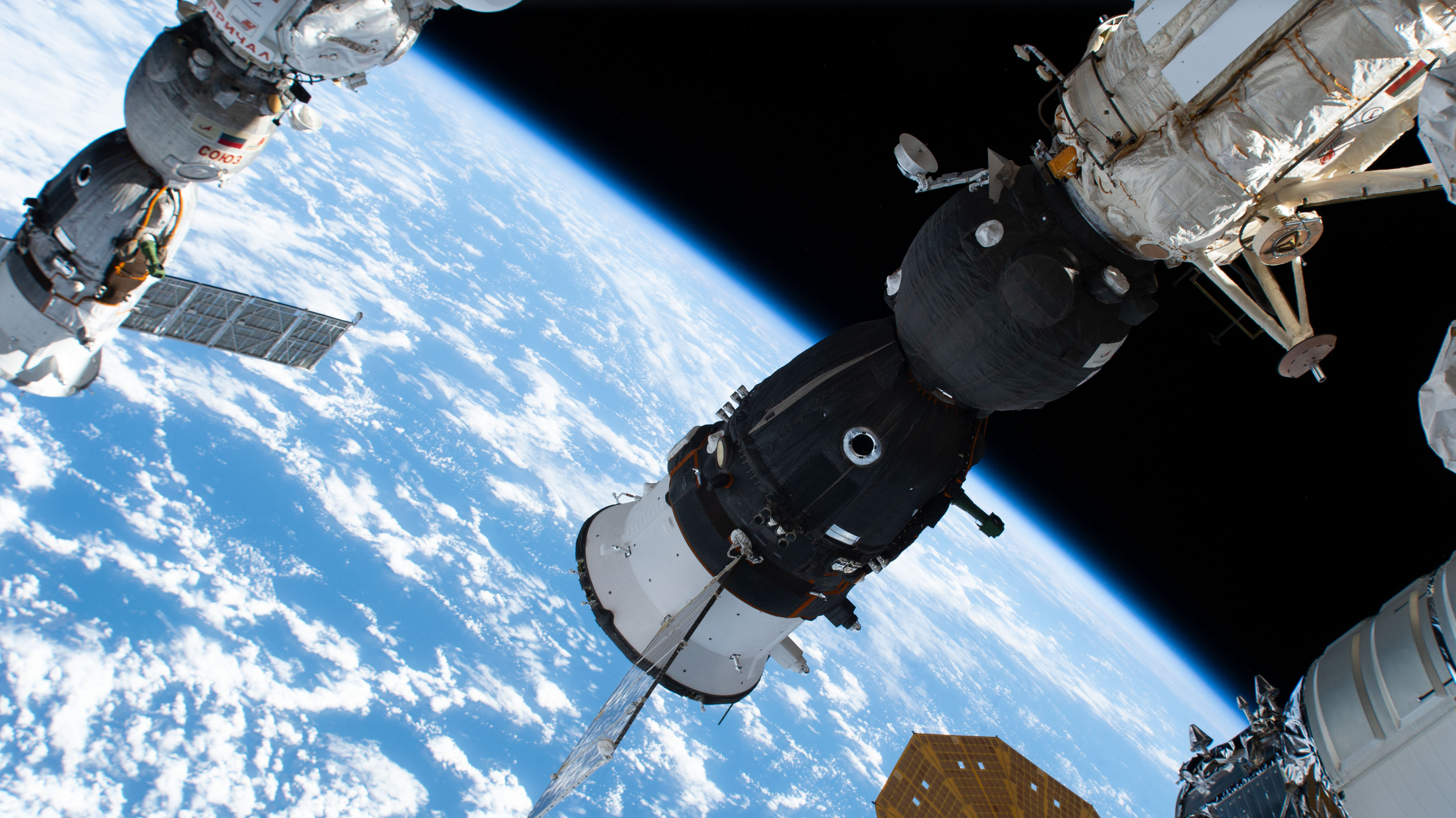 The Soyuz MS-24 spacecraft that carried NASA astronaut Loral O'Hara and Roscosmos cosmonauts Oleg Kononenko and Nikolai Chub to the International Space Station is pictured docked to the Rassvet module. At far left, is the Soyuz MS-23 crew ship, docked to the Prichal docking module, that will return NASA astronaut Frank Rubio and Roscosmos cosmonauts Sergey Prokopyev and Dmitri Petelin back to Earth on Sept. 27.