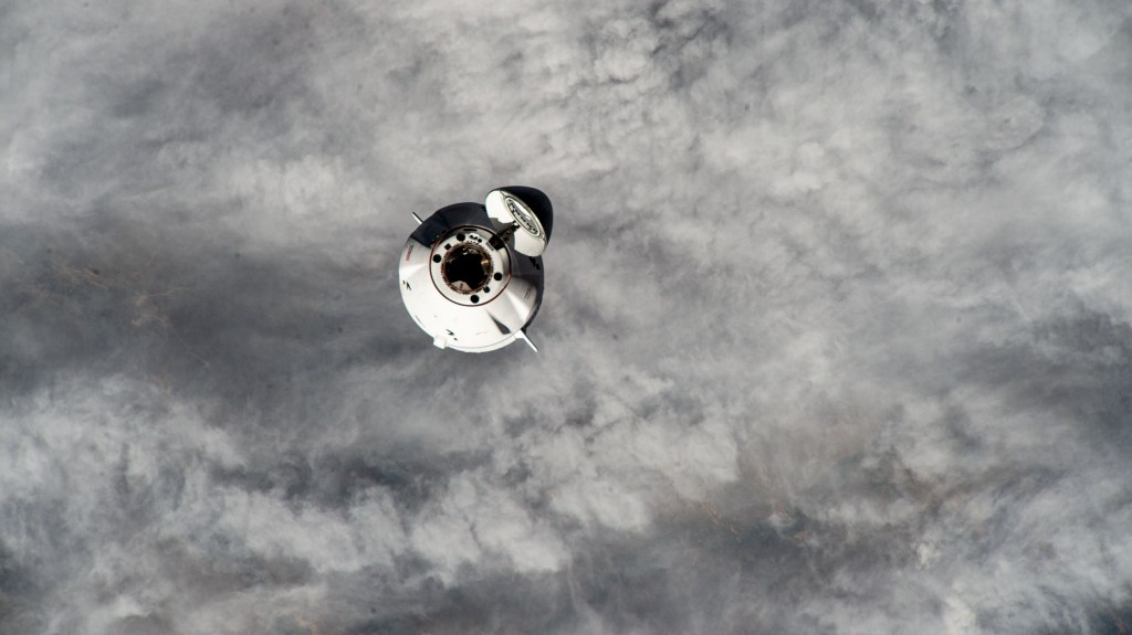 The SpaceX Dragon cargo vehicle approaches the International Space Station for an automated docking less than a day after launching from NASA's Kennedy Space Center loaded with over 7,000 pounds of science experiments, station hardware, and crew supplies. Both spacecraft were orbiting 260 miles above northern Mongolia at the time of this photograph from the orbital outpost.