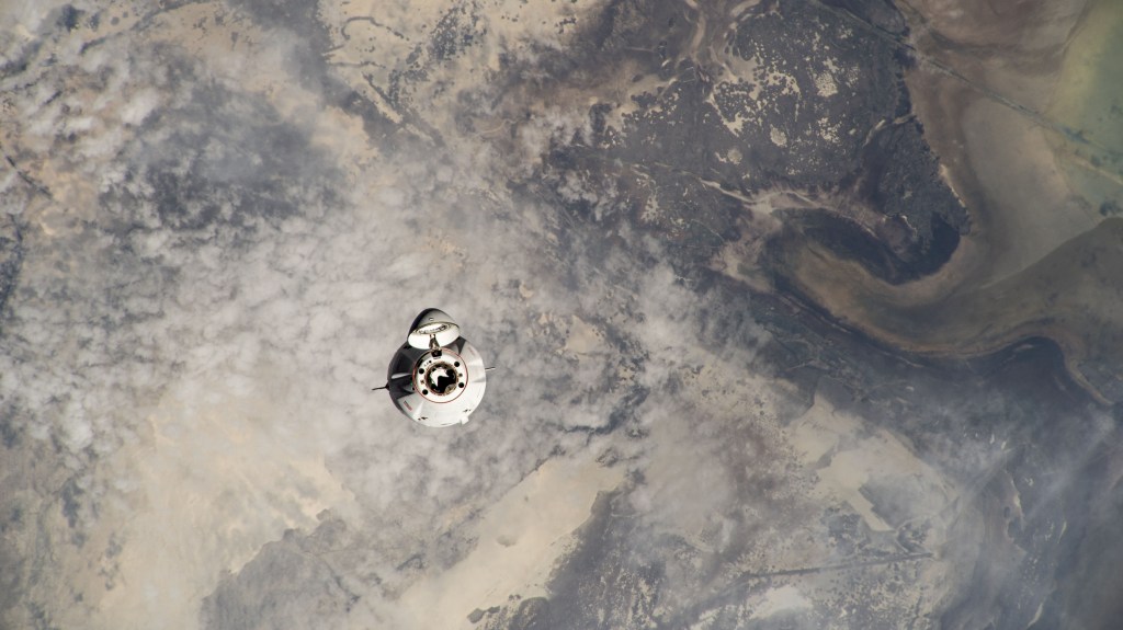 The SpaceX Dragon cargo vehicle approaches the International Space Station for an automated docking less than a day after launching from NASA's Kennedy Space Center loaded with over 7,000 pounds of science experiments, station hardware, and crew supplies. Both spacecraft were orbiting 259 miles above Kazakhstan just north of the Caspian Sea at the time of this photograph from the orbital outpost.