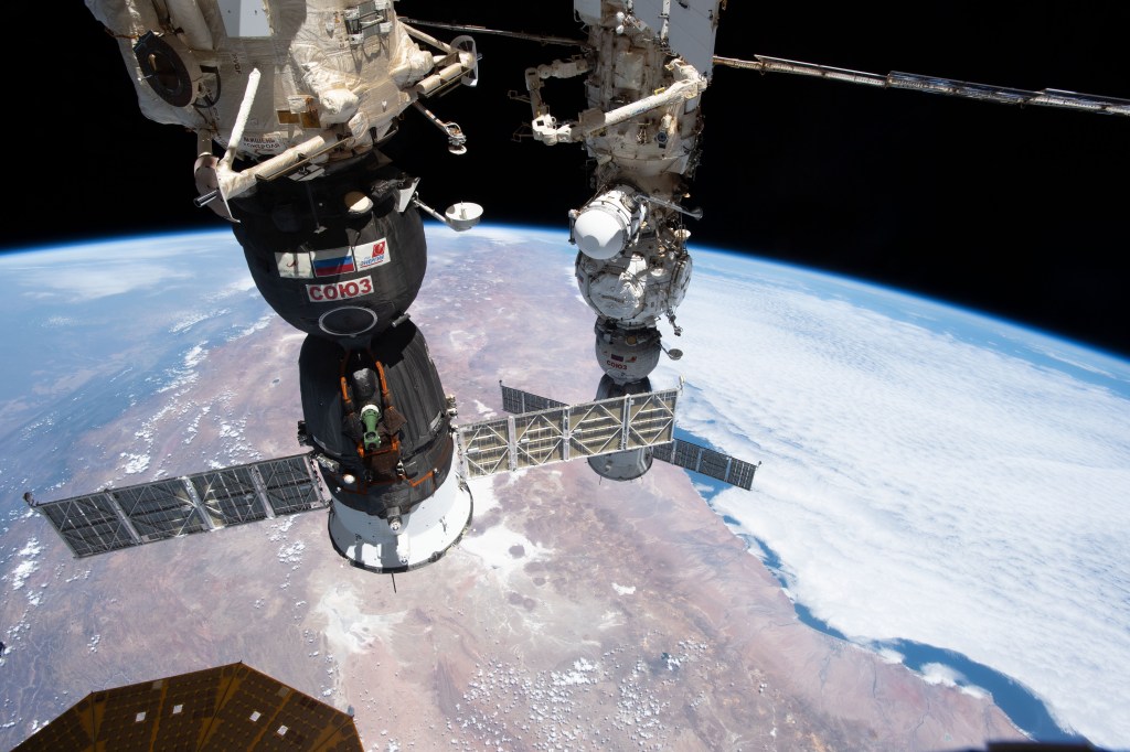 Two Soyuz crew ships are pictured docked to the International Space Station as it orbited 262 miles above La Paz, Bolivia, on the South American continent. In the foreground, is the Soyuz MS-24 spacecraft docked to the Rassvet module. In the background is the Soyuz MS-23 spacecraft docked to the Prichal docking module.