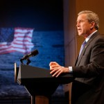 President George W. Bush speaks at a podium at NASA Headquarters