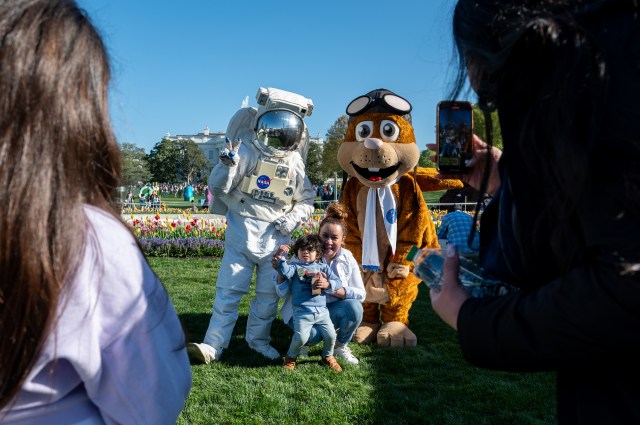 Spacey Casey, left, and NASA Aeronautics' mascot Orville the Flying Squirrel, right, pose for photos with guests during the White House Easter Egg Roll, Monday, April 10, 2023, on the South Lawn of the White House in Washington. Photo Credit: (NASA/Keegan Barber)
