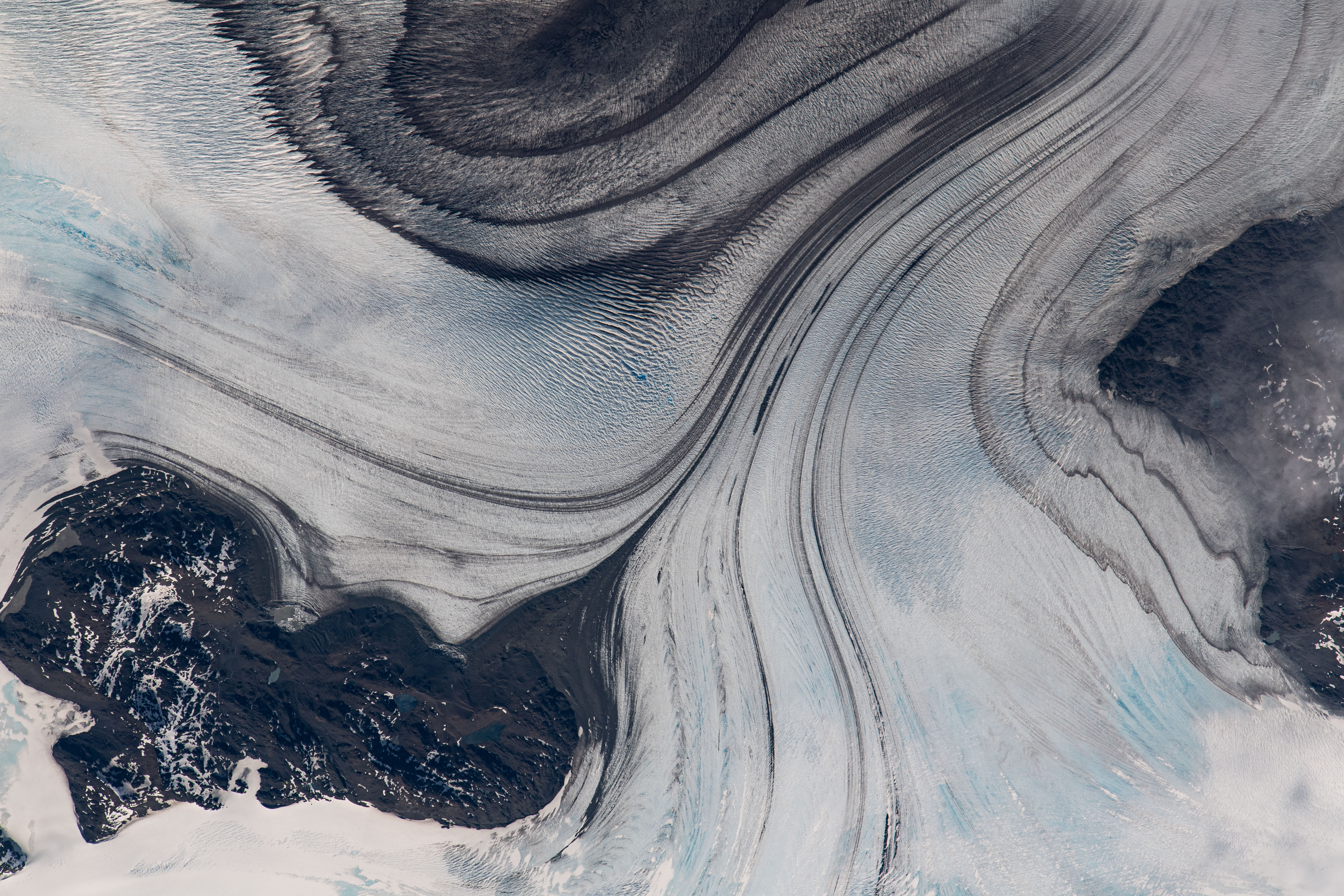 iss070e049061 (Dec. 27, 2023) -- As the International Space Station orbited 268 miles above the coast of Chile, snow drifts through glaciated mountain ranges in Southern Patagonia.