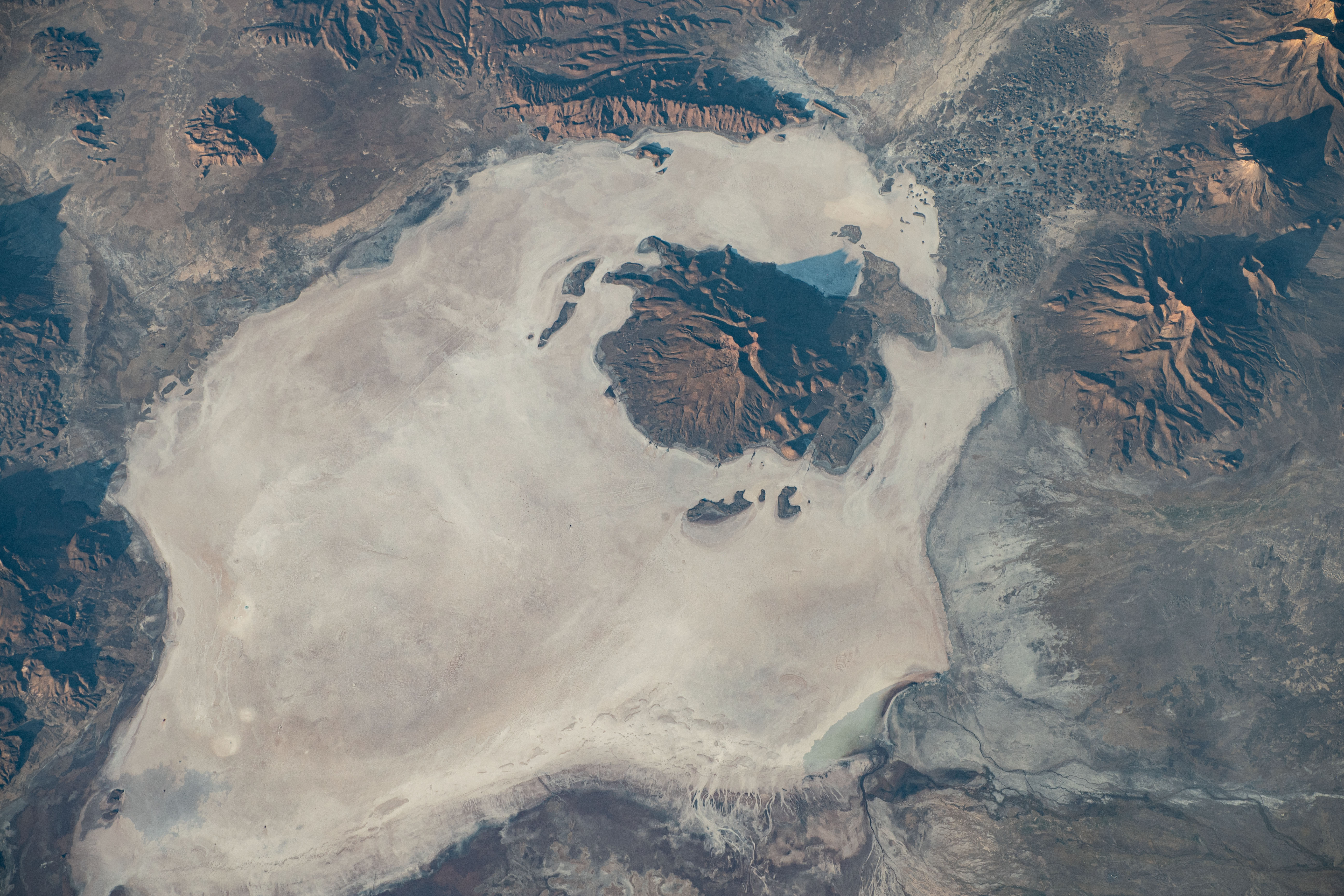 iss070e064291 (Jan. 12, 2024) -- In the Coipasa Salt Pan lies the Wila Pukarani volcano located in Bolivia. As the International Space Station orbited 262 miles above, the stark white salt flats contrast against the dark surrounding rock. Summiting nearly 16,000 feet high (~4,900 meters), the volcano is estimated to be 3.7 million years old.