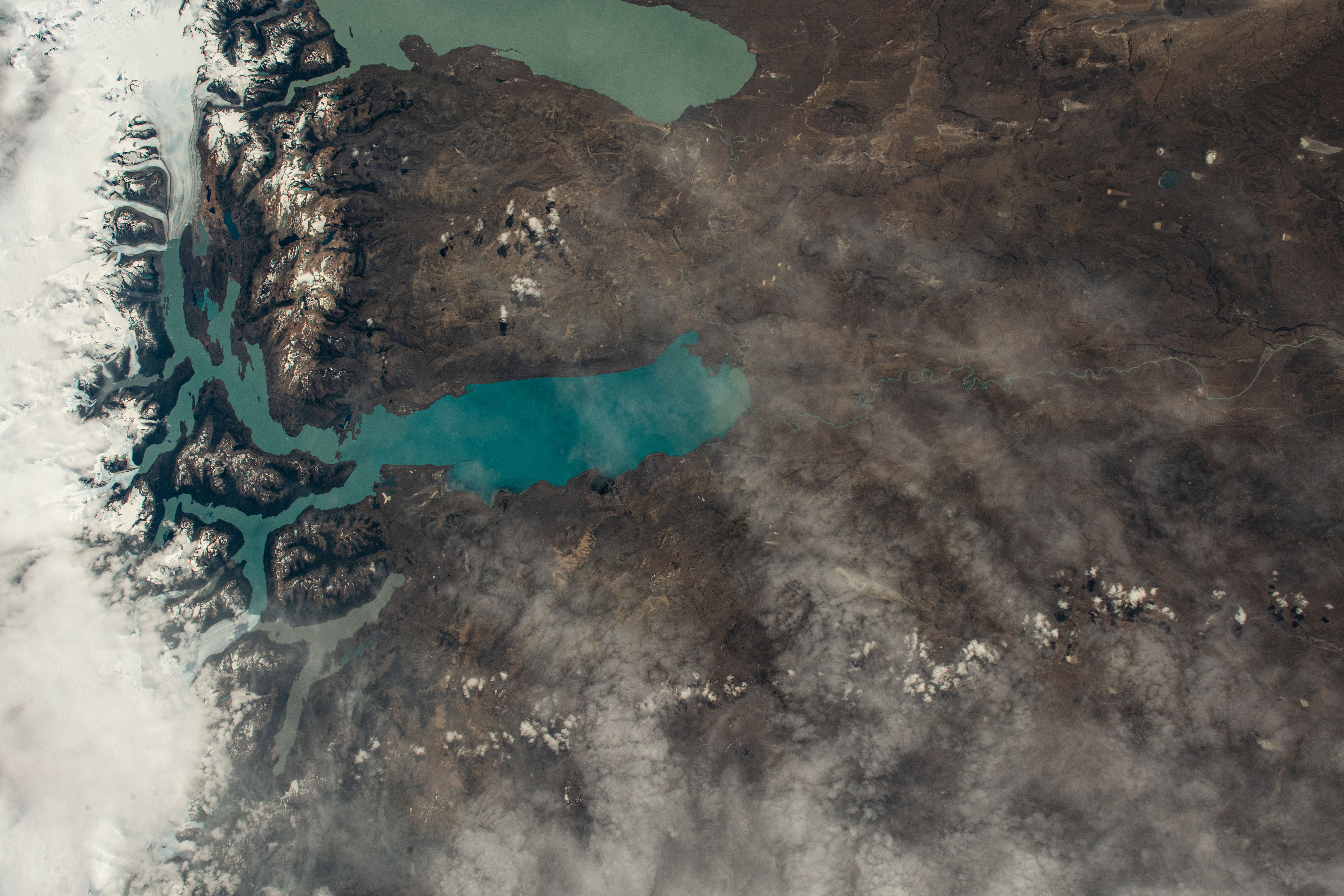 iss070e064477 (Jan. 12, 2024) -- As the International Space Station orbited 270 miles above Southern Patagonia, two lakes run nearly parallel to one another as they feed into rivers and mountain streams within Los Glaciares National Park. On the bottom is Argentino Lake, the largest freshwater lake in Argentina. Above it is Viedma Lake, fed by a glacier of the same name.