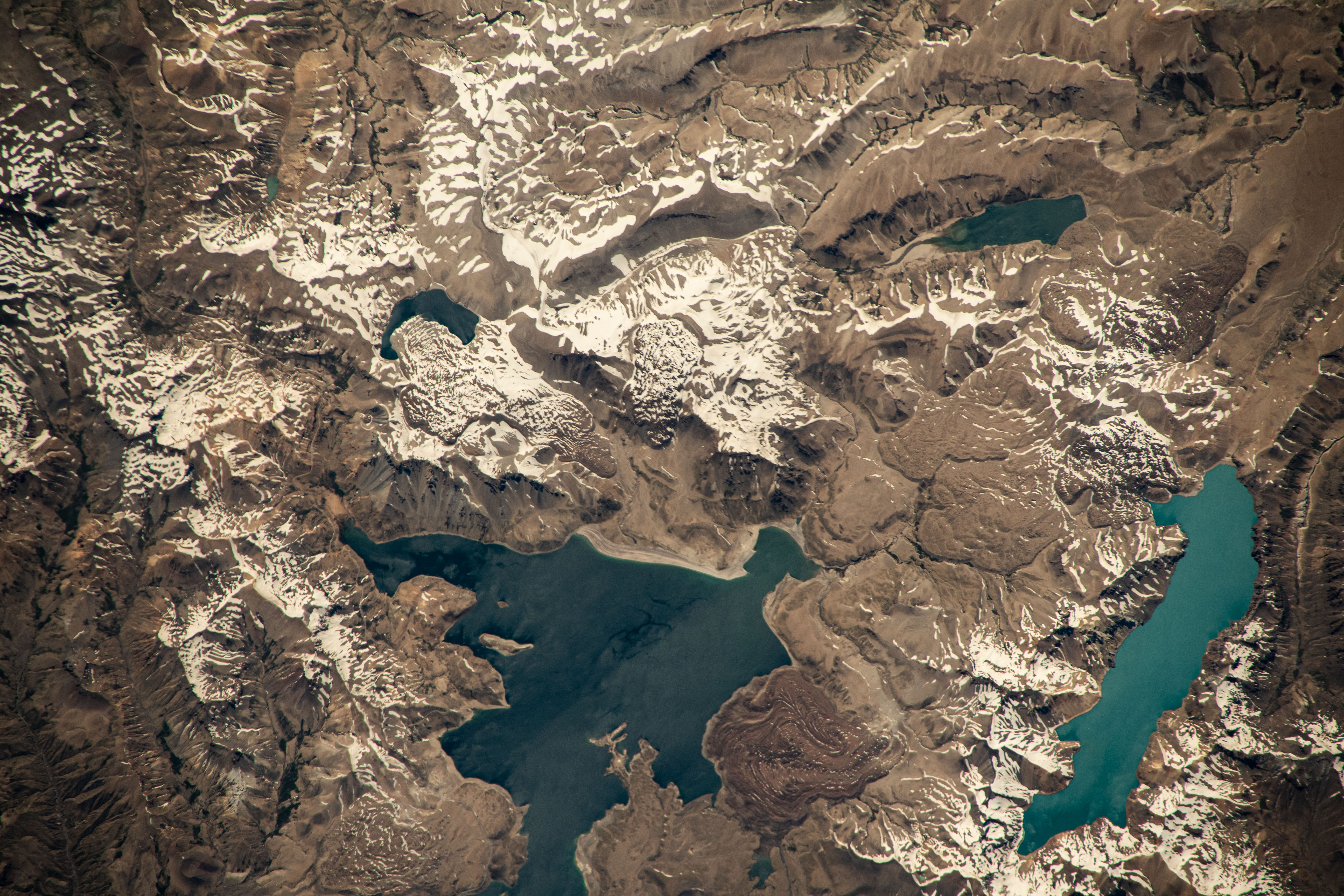 iss070e063867 (Jan. 8, 2024) -- In the Andes Mountain Range, Laguna del Maule (left) and Laguna Fea (right) lie within a volcanic field located in Chile. The International Space Station orbited 267 miles above as this photograph was taken.