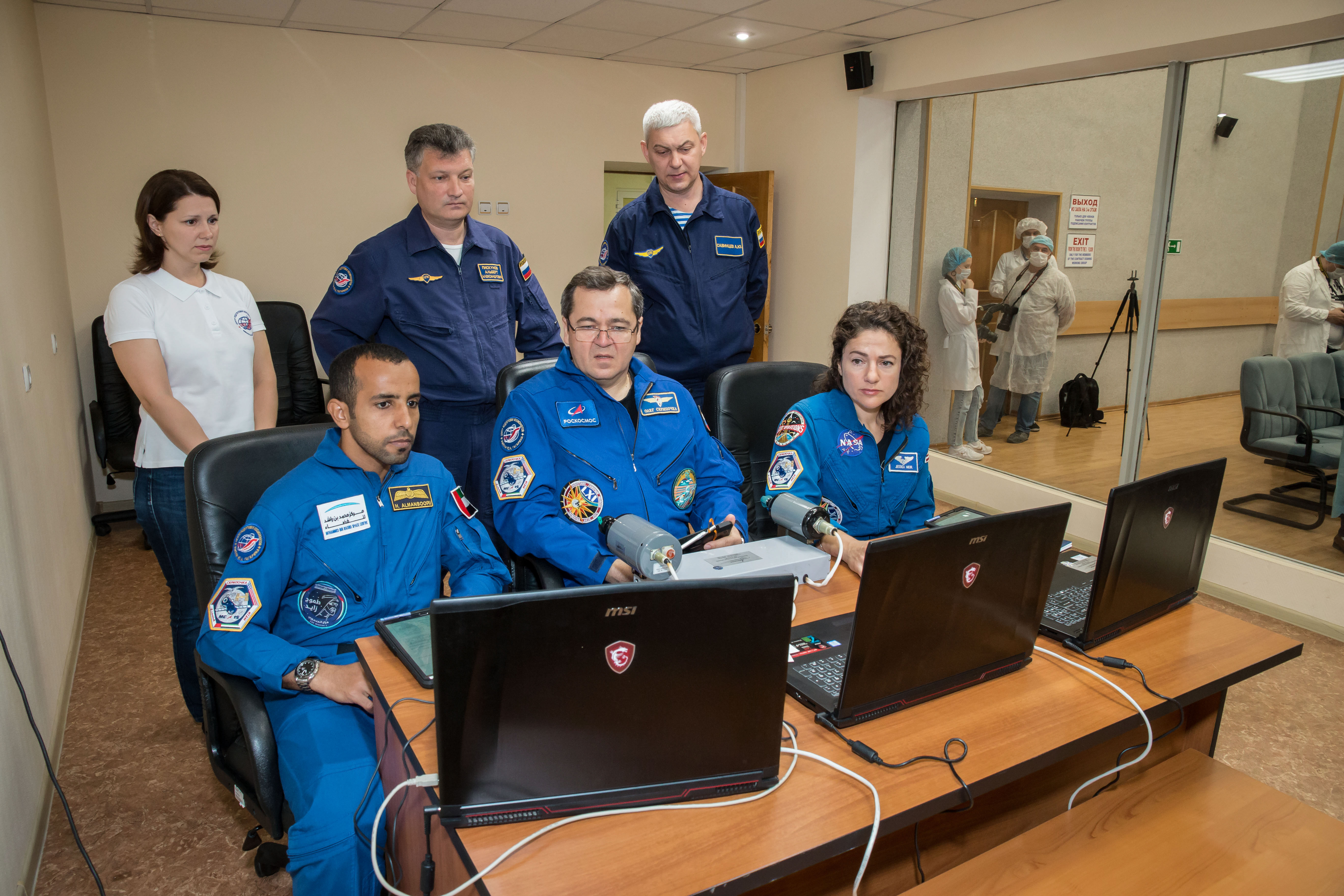 At the Cosmonaut Hotel crew quarters in Baikonur, Kazakhstan, the next crew to launch to the International Space Station practices rendezvous techniques on a laptop computer simulator Sept. 18 as part of pre-launch training. Spaceflight participant Hazzaa Ali Almansoori of the United Arab Emirates (left) and Expedition 61 crewmembers Oleg Skripochka of Roscosmos (center) and Jessica Meir of NASA (right) are set to launch Sept. 25 from the Baikonur Cosmodrome in Kazakhstan on the Soyuz MS-15 spacecraft for a mission on the International Space Station. Credit: NASA/Victor Zelentsov