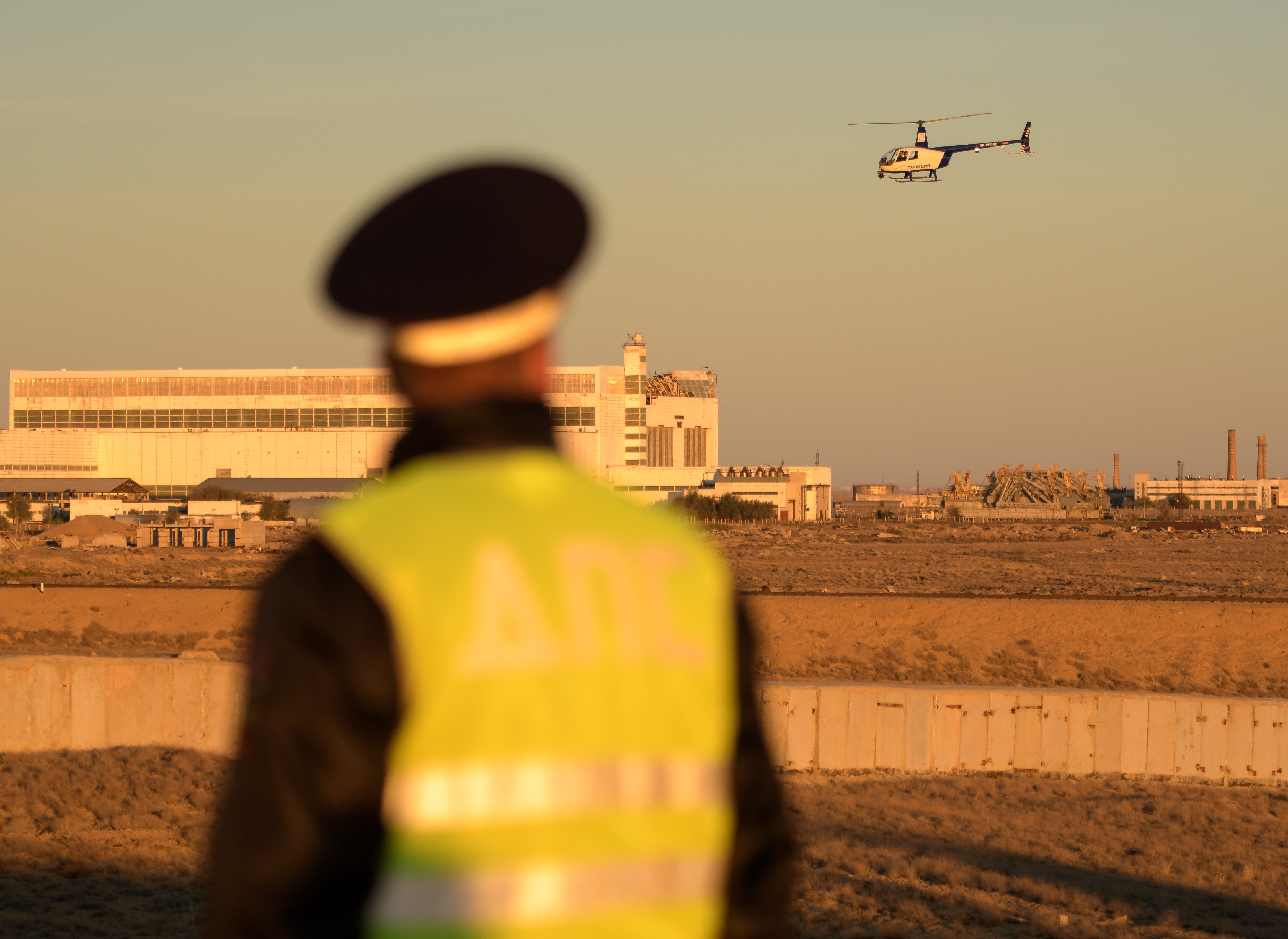 A security helicopter team surveys the train tracks in advance of the Soyuz rocket being rolled out to the launch pad, Tuesday, Oct. 9, 2018 at the...