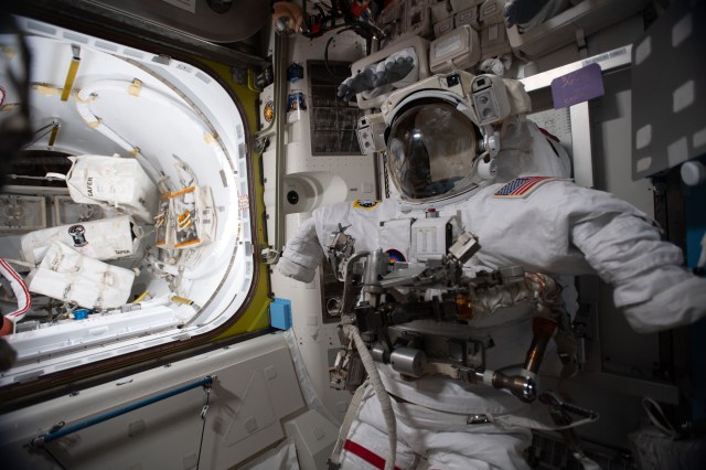 A U.S. spacesuit is pictured in the Quest airlock during a break in spacewalk preparations. Expedition 63 Commander Chris Cassidy and Flight Engineer Bob Behnken will exit the International Space Station on June 26 and July 1 for a pair of spacewalks to upgrade power systems on the orbiting laboratory.