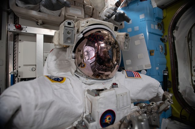 A U.S. spacesuit is pictured in the Quest airlock of the International Space Station ahead of spacewalks that astronauts Chris Cassidy and Behnken will conduct to upgrade orbital lab power systems.