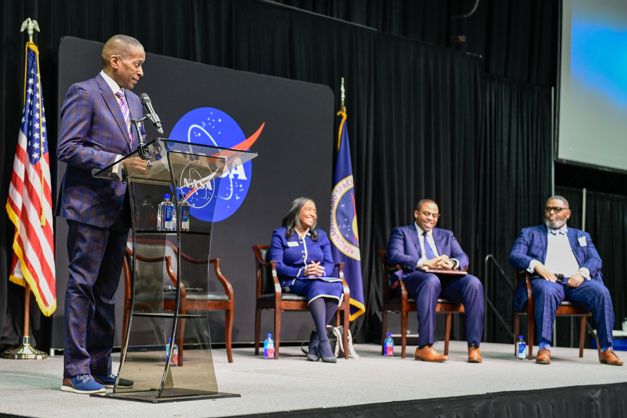 Kenny Anderson, director of Huntsville City’s Office of Diversity, Equity & Inclusion, speaks about Martin Luther King Jr. during an Jan. 11 event honoring King’s life and legacy ahead of what would have been the civil rights icon’s 95th birthday. Joining Anderson on stage are, from left, Global Ties CEO Jacquelyn Gates Shipe; social scientist and professor Darell Ezell; and Bryan Samuel, vice president of Diversity, Equity & Inclusion at the University of Alabama in Huntsville.