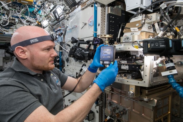ESA (European Space Agency) astronaut Alexander Gerst configures the Light Microscopy Module (LMM) for the Advanced Colloids Experiment-Temperature-7 (ACE-T-7) experiment. ACE-T-7 involves the design and assembly of complex three-dimensional structures from small particles suspended within a fluid medium. These so-called “self-assembled colloidal structures”, are vital to the design of advanced optical materials and active devices. In the microgravity environment, insight is provided into the relation between particle shape and interparticle interactions on assembly structure and dynamics: fundamental issues in condensed matter science.