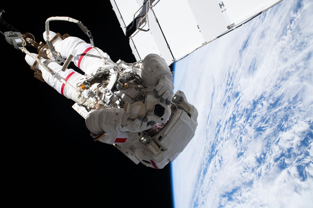 Astronaut and spacewalker Luca Parmitano of ESA (European Space Agency) soars 250 miles above the Earth's surface attached to an articulated portable foot restraint, connected to the tip of the Canadarm2 robotic arm. He and fellow astronaut Andrew Morgan (out of frame) were conducting the second spacewalk to repair the International Space Station's cosmic particle detector, the Alpha Magnetic Spectrometer.