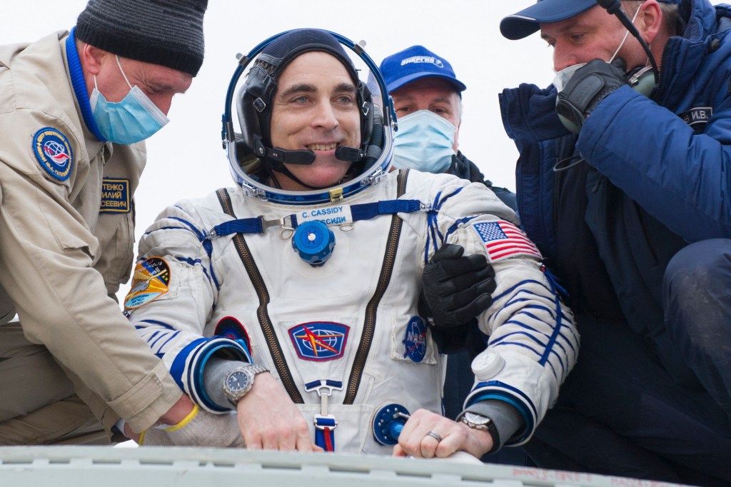 Expedition 63 NASA astronaut Chris Cassidy is helped out of the Soyuz MS-16 spacecraft just minutes after he and Roscosmos cosmonauts Anatoly Ivanishin, and Ivan Vagner, landed in a remote area near the town of Zhezkazgan, Kazakhstan on Thursday, October 22, 2020, Kazakh time (Oct. 21 Eastern time). Cassidy, Ivanishin and Vagner returned after 196 days in space having served as Expedition 62-63 crew members onboard the International Space Station.