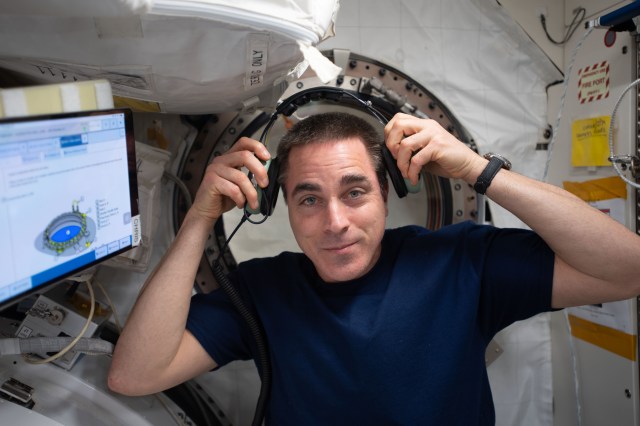 NASA astronaut and Expedition 63 Commander Chris Cassidy is at work inside the Kibo laboratory module from JAXA (Japan Aerospace Exploration Agency).