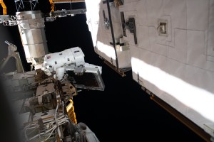 NASA astronaut Christina Koch is pictured near a solar array during a spacewalk to finalize upgrading power systems on the International Space Station's Port-6 truss structure.