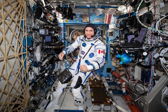 Astronaut David Saint-Jacques of the Canadian Space Agency wears his Sokol launch and entry suit during a leak check before he departs the International Space Station on June 24. He and fellow Expedition 59 crewmembers Anne McClain of NASA and Oleg Kononenko of Roscosmos will wear their Sokol suits when they return to Earth inside the Soyuz MS-11 spacecraft completing a 204-day mission.