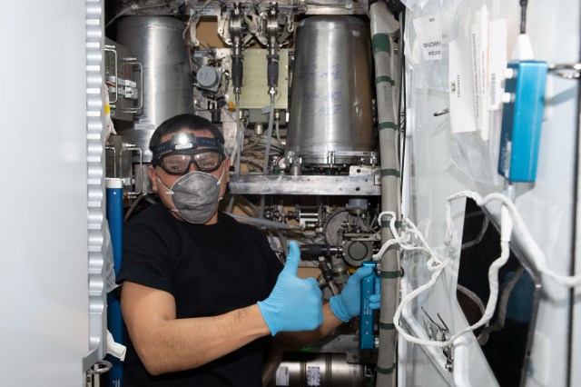 iss068e050628 (Feb. 9, 2023) --- NASA astronaut and Expedition 68 Flight Engineer Frank Rubio swaps orbital plumbing components inside the Waste and Hygiene Compartment, the International Space Station's bathroom located in the Tranquility module.