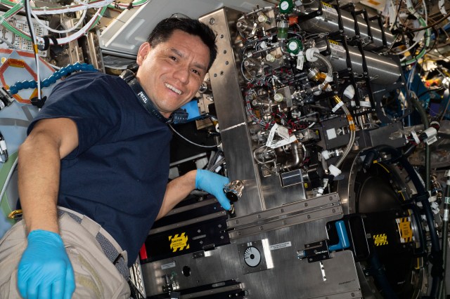 iss068e027723 (Dec. 7, 2022) --- NASA astronaut and Expedition 68 Flight Engineer Frank Rubio replaces components inside the Combustion Integrated Rack, a research facility that enables safe observations of flame, fuel, and soot phenomena in microgravity.