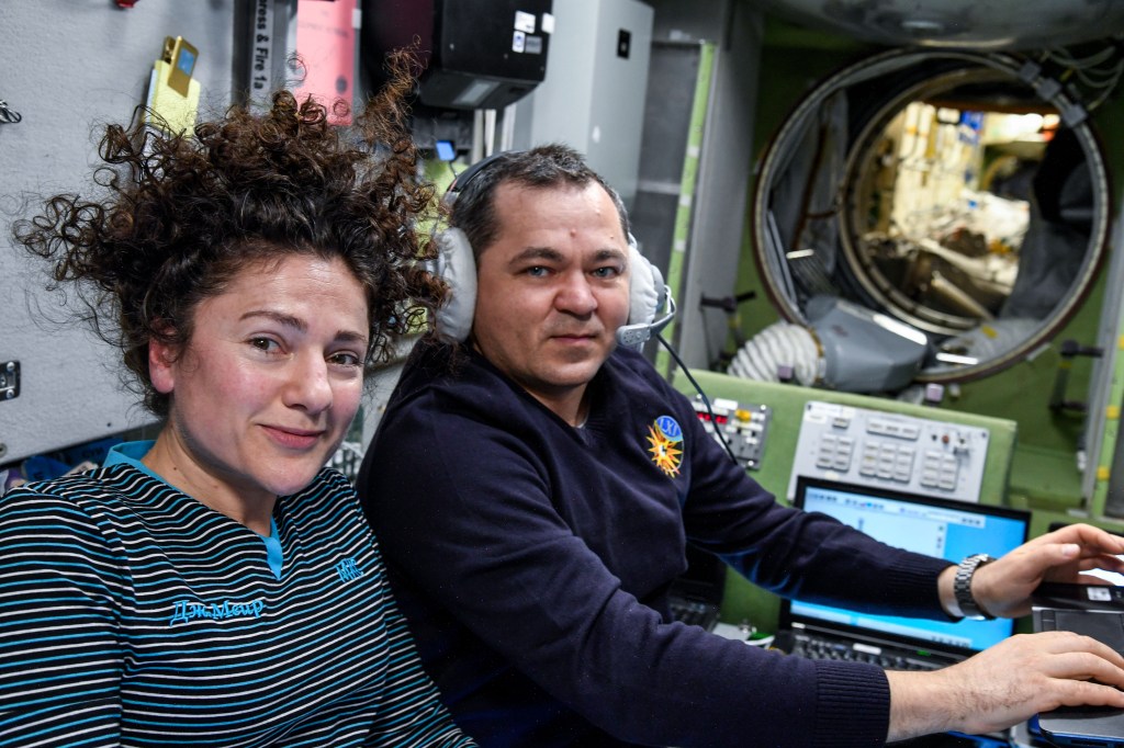 NASA astronaut Jessica Meir and Roscosmos cosmonaut Oleg Skripochka, both Expedition 61 Flight Engineers, pose for a portrait inside the International Space Station's Zvezda service module.