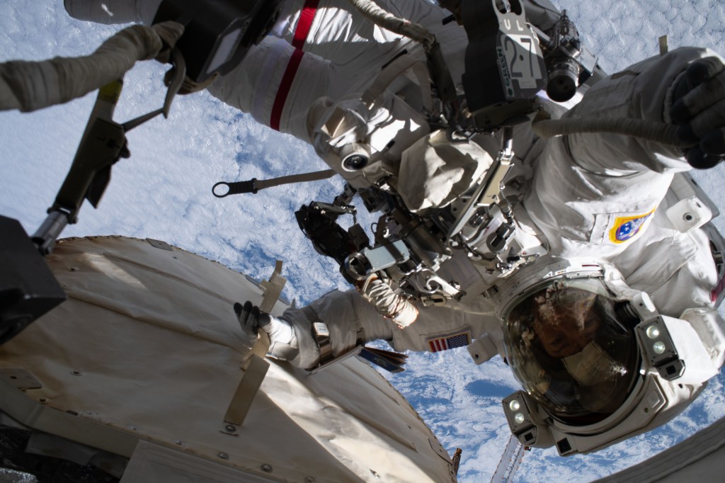NASA astronaut Jessica Meir is pictured during a spacewalk to finalize upgrading power systems on the International Space Station's Port-6 truss structure. Meir had her photograph taken by fellow NASA astronaut Christina Koch as both spacewalkers were working 266 miles above the Pacific Ocean off the coast of New Zealand.