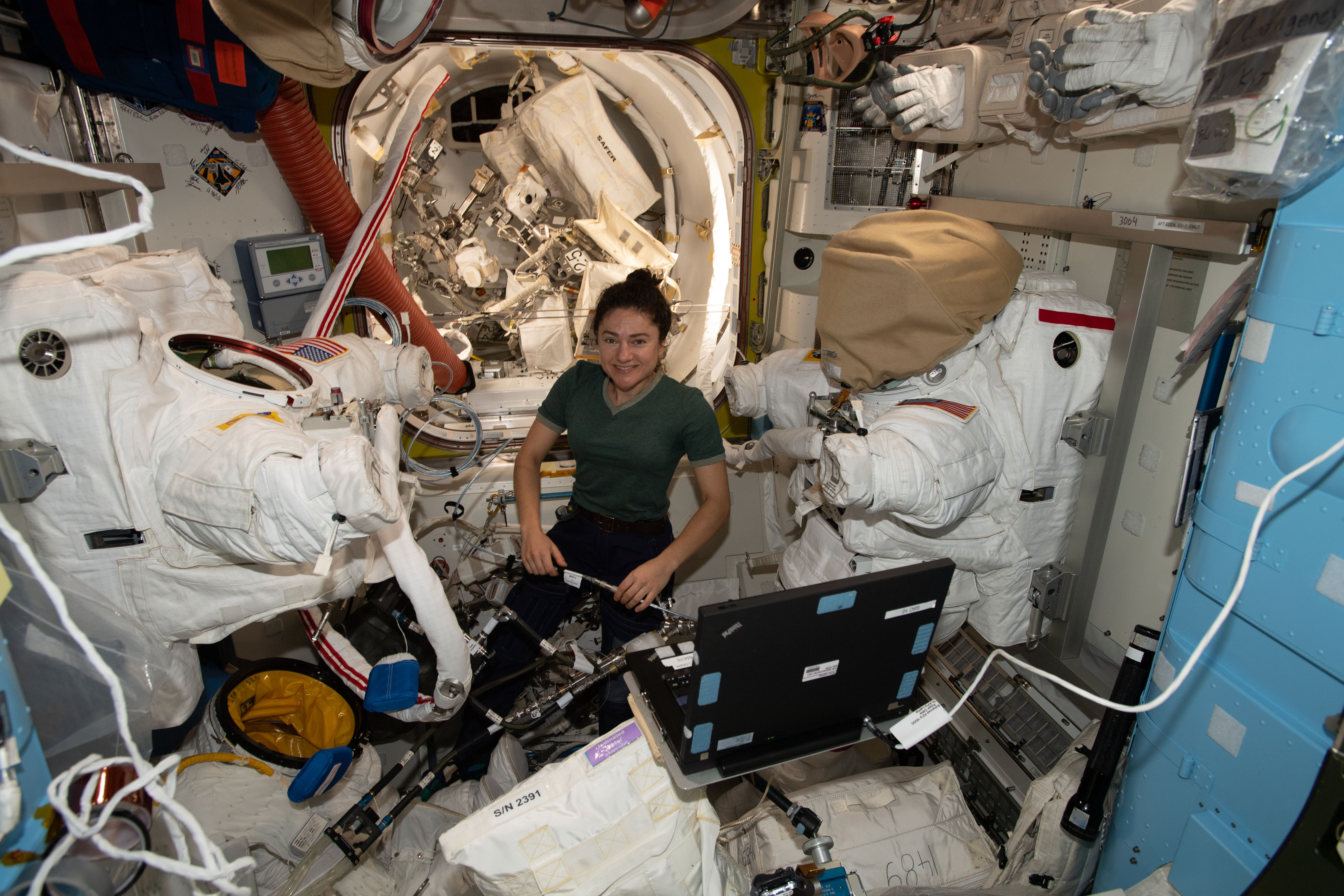 NASA astronaut Jessica Meir works in the Quest airlock on U.S. spacesuits that she and fellow NASA astronaut Jessica Koch wore during a pair of spacewalks on Jan. 15 and Jan. 20. The duo finalized upgrading power systems on the International Space Station's Port-6 truss structure during both spacewalks.
