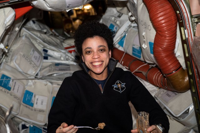 iss068e008036 (Oct. 4, 2022) --- NASA astronaut and Expedition 68 Flight Engineer Jessica Watkins is pictured eating a meal aboard the International Space Station.