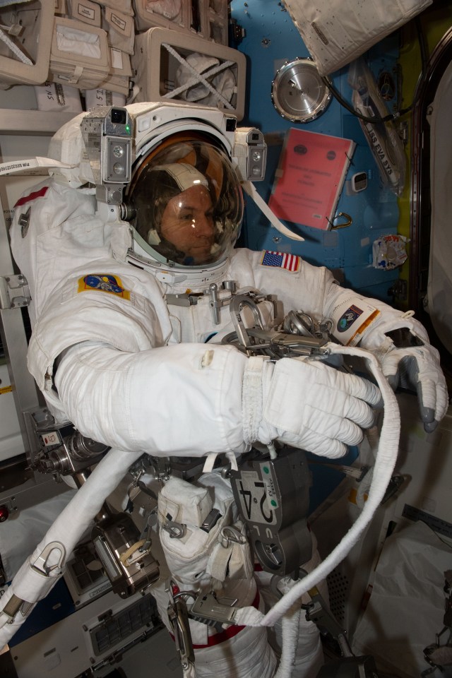 iss068e022316 (Nov. 15, 2022) --- NASA astronaut and Expedition 68 Flight Engineer Josh Cassada is pictured suited up inside his Extravehicular Mobility Unit (EMU), or spacesuit, before beginning a seven-hour and 11-minute a spacewalk to ready the orbiting lab's starboard truss structure for future rollout solar array installation work. Credit: Koichi Wakata/Japan Aerospace Exploration Agency (JAXA)