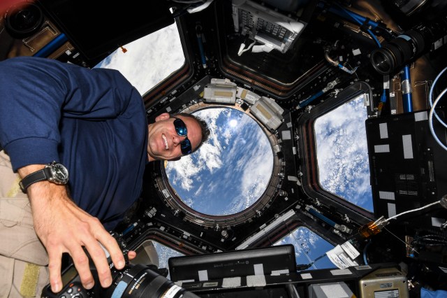 iss068e025344 (Nov. 27, 2022) --- NASA astronaut and Expedition 68 Flight Engineer Josh Cassada is pictured inside the seven-window cupola as the SpaceX Dragon cargo craft approaches the International Space Station for a docking.