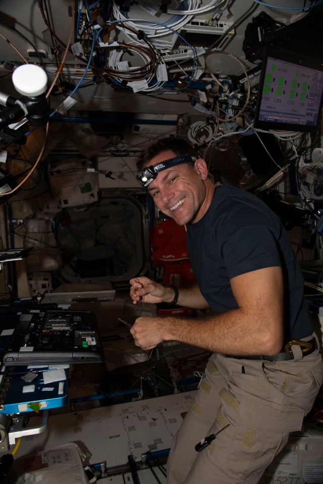 iss068e019723 (Oct. 25, 2022) --- NASA astronaut and Expedition 68 Flight Engineer Josh Cassada performs laptop computer maintenance inside the International Space Station's Harmony module.
