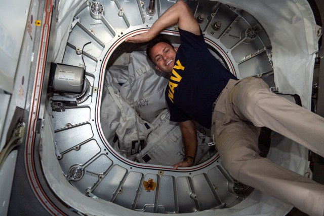 iss068e017325 (Oct. 17, 2022) --- NASA astronaut and Expedition 68 Flight Engineer Josh Cassada poses in front of BEAM, the Bigelow Expandable Activity Module, during cargo activities aboard the International Space Station.