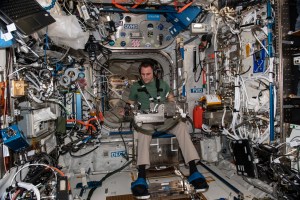iss068e054121 (Feb. 14, 2023) --- NASA astronaut and Expedition 68 Flight Engineer Josh Cassada is seated in a specialized chair in the International Space Station's Columbus laboratory module for a human research experiment. The study investigates how astronauts regulate their grip force and move their arms when manipulating objects in microgravity in response to pre-programmed stimuli as a computer and video cameras record the responses.