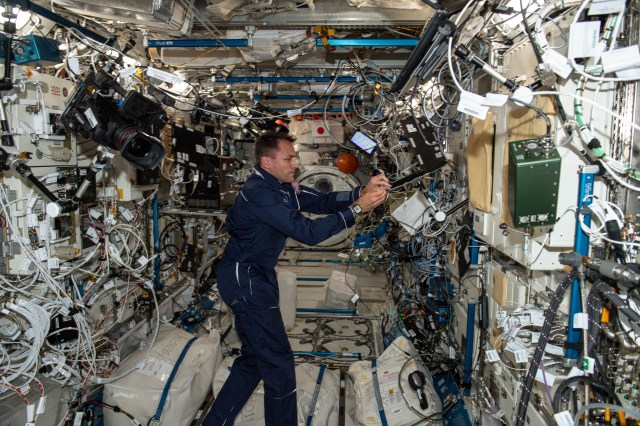 iss068e017360 (Oct. 18, 2022) --- NASA astronaut and Expedition 68 Flight Engineer Josh Cassada works on a laptop computer inside the Kibo laboratory module aboard the International Space Station.